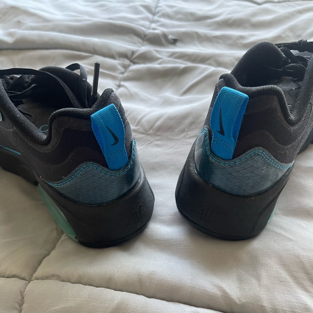 Black and blue Nike. Worn once for two hours.